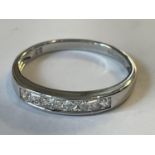 A 9 CARAT WHITE GOLD RING WITH CUBIC ZIRCONIAS SIZE R