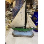 A VINTAGE CAST DOORSTOP IN THE SHAPE OF A SHIP HEIGHT 36CM