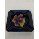 A MOORCROFT HIBISCUS PATTERN ASHTRAY