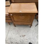 A CONTINENTAL OAK CABINET WITH DROP-DOWN FRONT AND SINGLE DRAWER, 29" WIDE