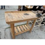 A SMALL WOODEN WORK BENCH WITH A 4" VICE