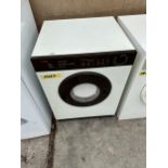 A SMALL CREDA COMPACT SENSADRY TUMBLE DRYER