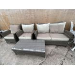 A RATTAN GARDEN FURNITURE SET COMPRISING OF A TWO SEATER SOFA, TWO CHAIRS AND A COFFEE TABLE