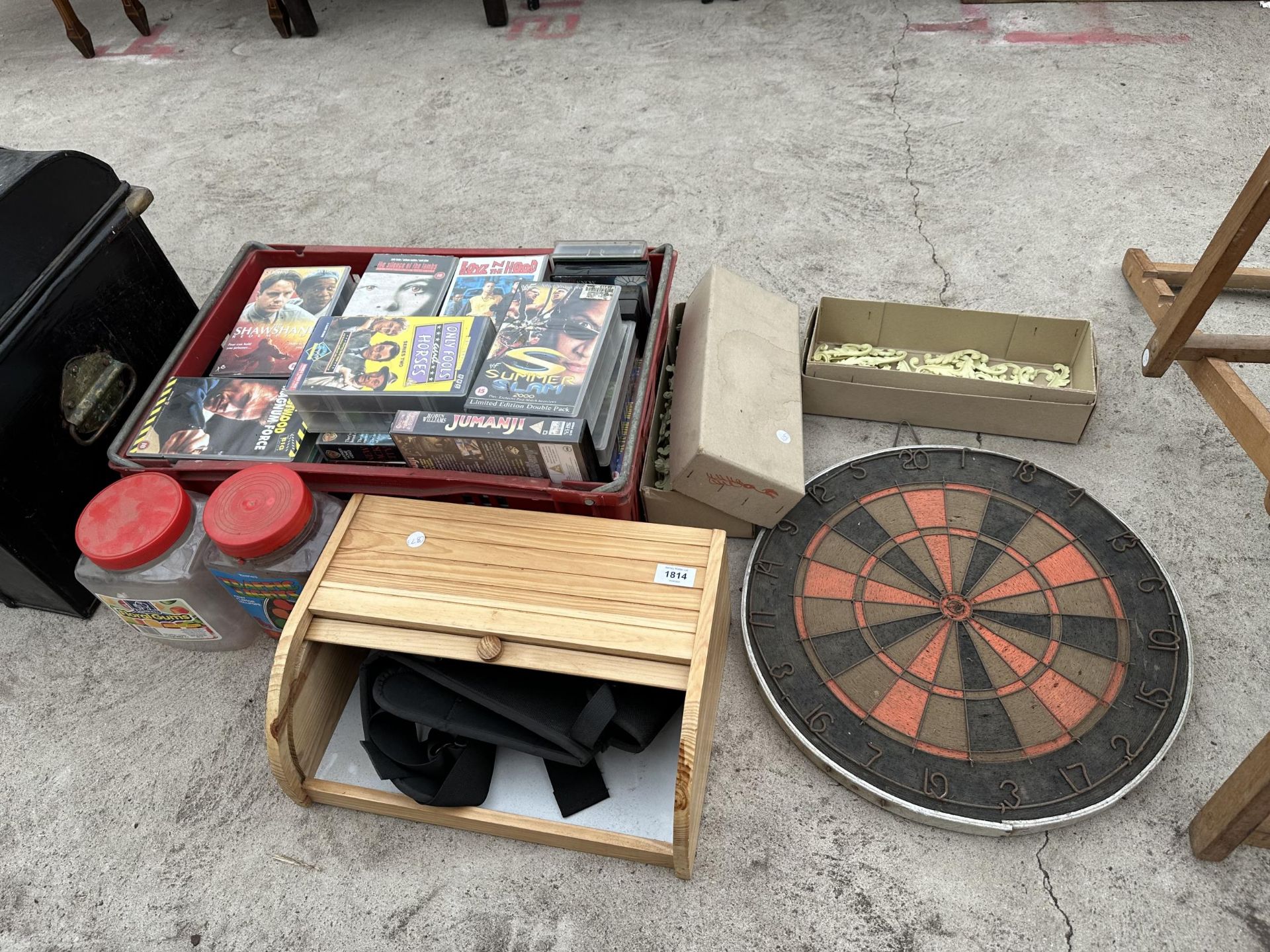 AN ASSORTMENT OF ITEMS TO INCLUDE A DART BOARD, VHS VIDEOS AND A BREAD BIN ETC