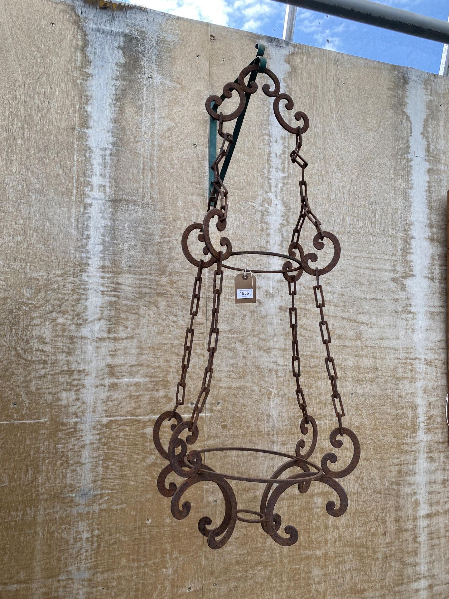 A VINTAGE DECORATIVE WROUGHT IRON HANGING TWO TIER PLANT POT HOLDER