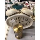 A WEST GERMAN JERGER WIND UP ALARM CLOCK AND FURTHER SWIZA CLOCK