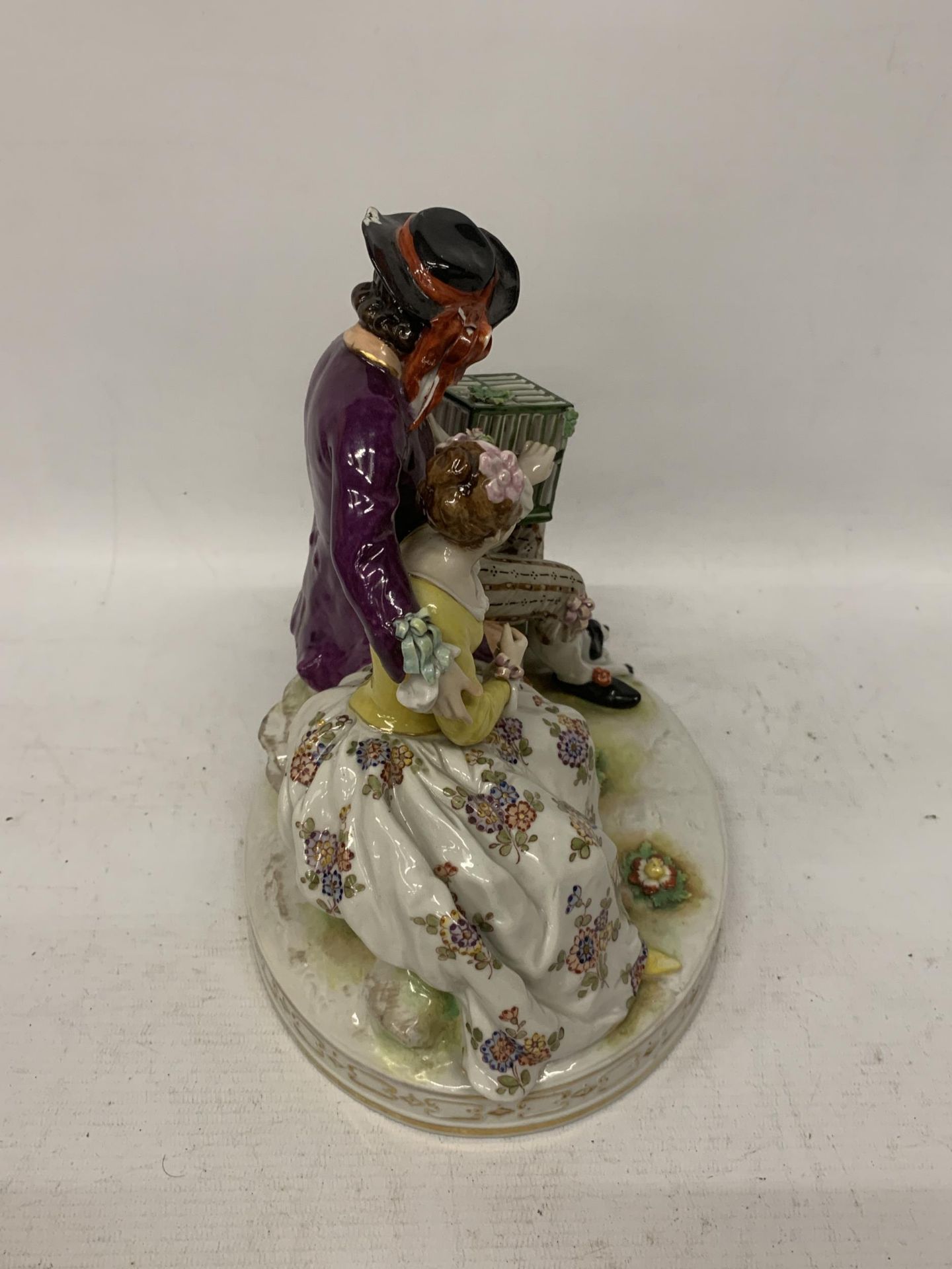 A BELIEVED RUDOLFSTADT CONTINENTAL PORCELAIN FIGURE GROUP DEPICTING A GENT AND LADY WITH A DOG - Image 2 of 4