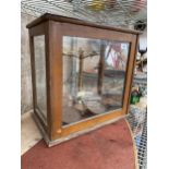 A SET OF VINTAGE 'PHILIP HARRIS LTD BIRMINGHAM' BALANCE SCALES IN A WOODEN AND GLASS DISPLAY CABINET