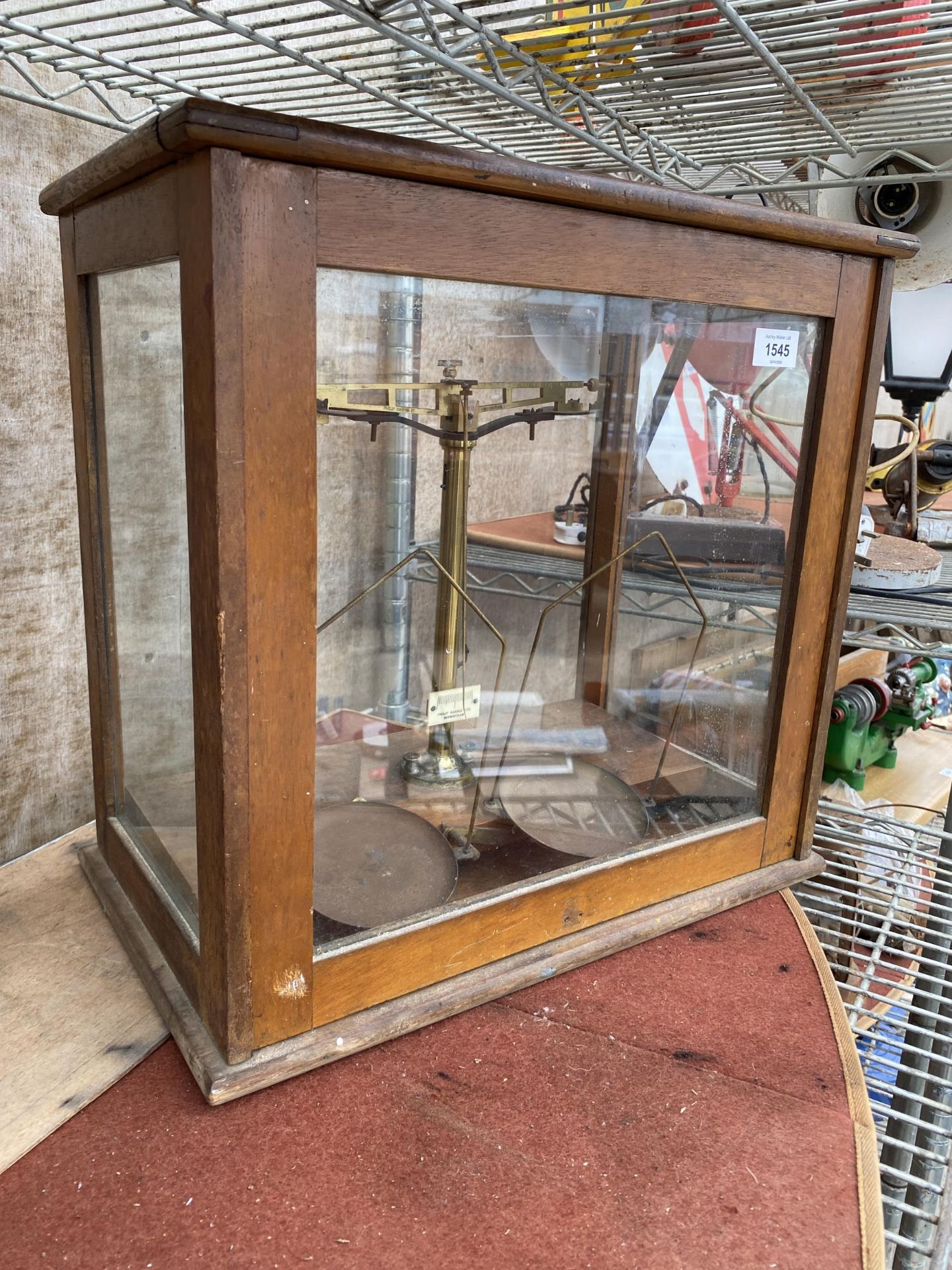 A SET OF VINTAGE 'PHILIP HARRIS LTD BIRMINGHAM' BALANCE SCALES IN A WOODEN AND GLASS DISPLAY CABINET