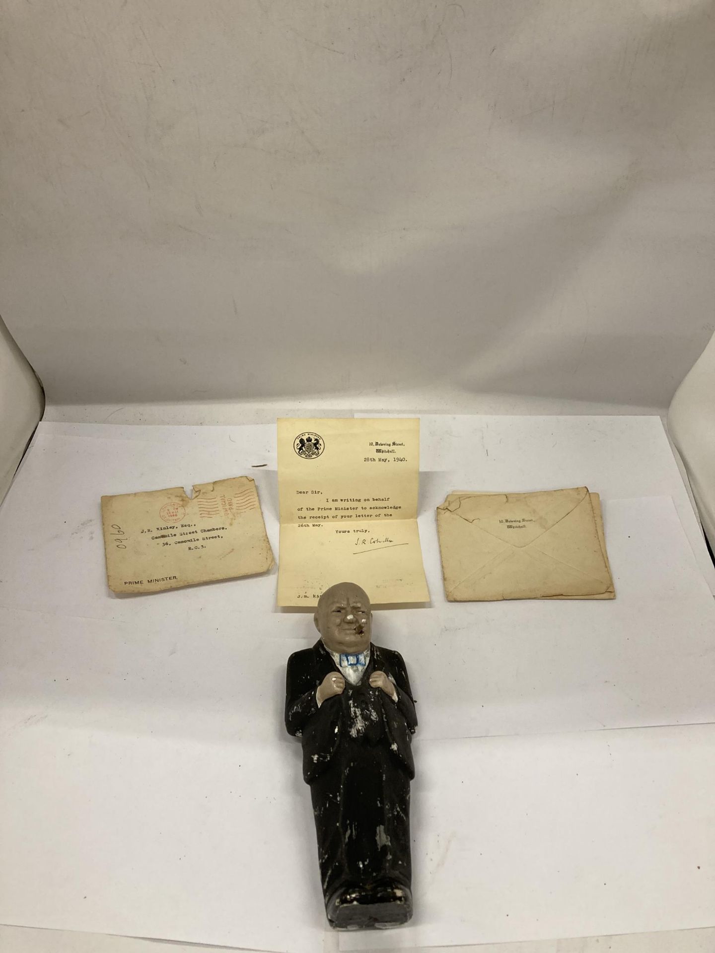 A FIGURE OF WINSTON CHURCHILL WITH DOWNING ST LETTERS