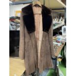 A VINTAGE SHEEPSKIN COAT WITH A FUR COLLAR