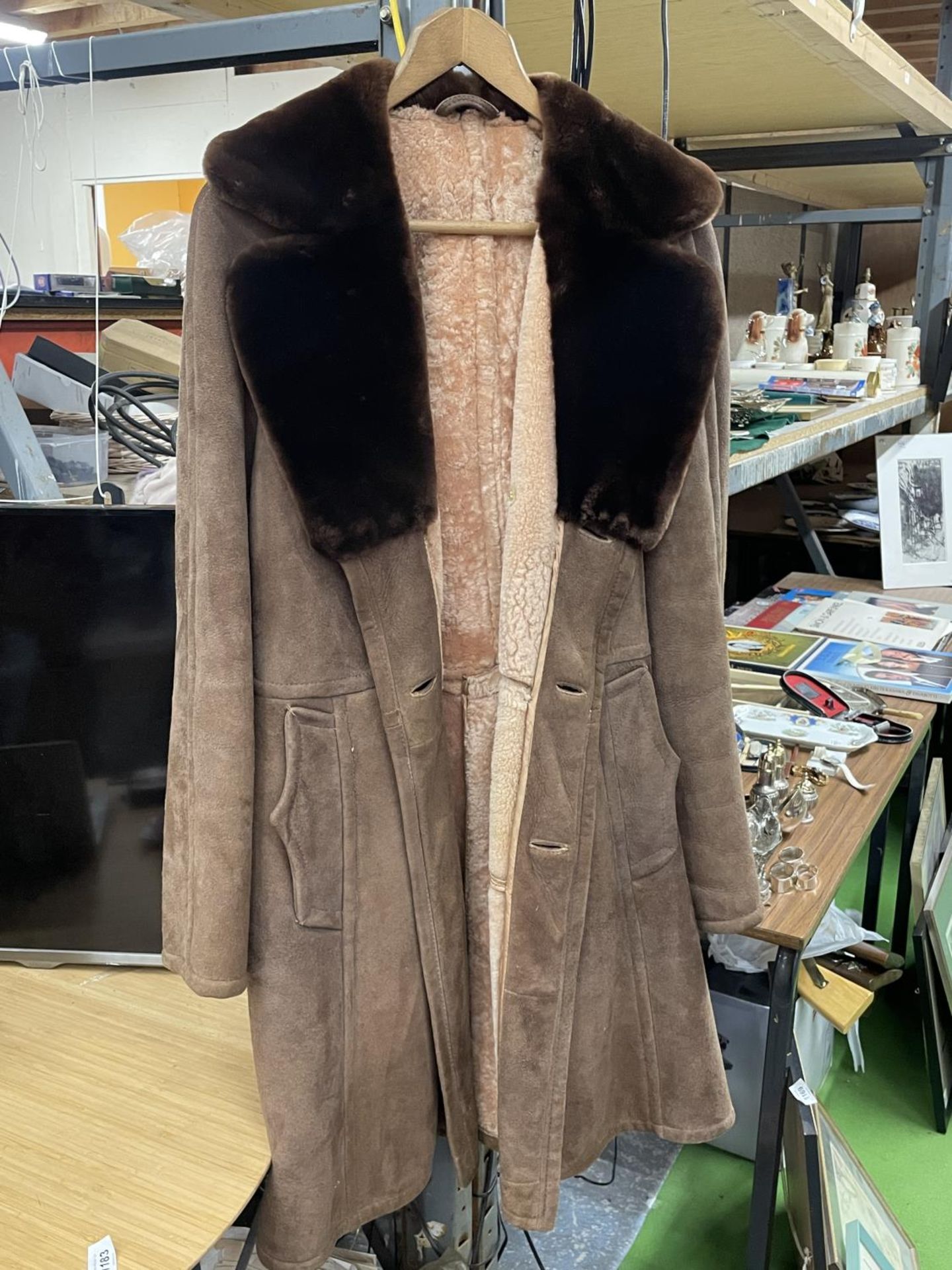 A VINTAGE SHEEPSKIN COAT WITH A FUR COLLAR