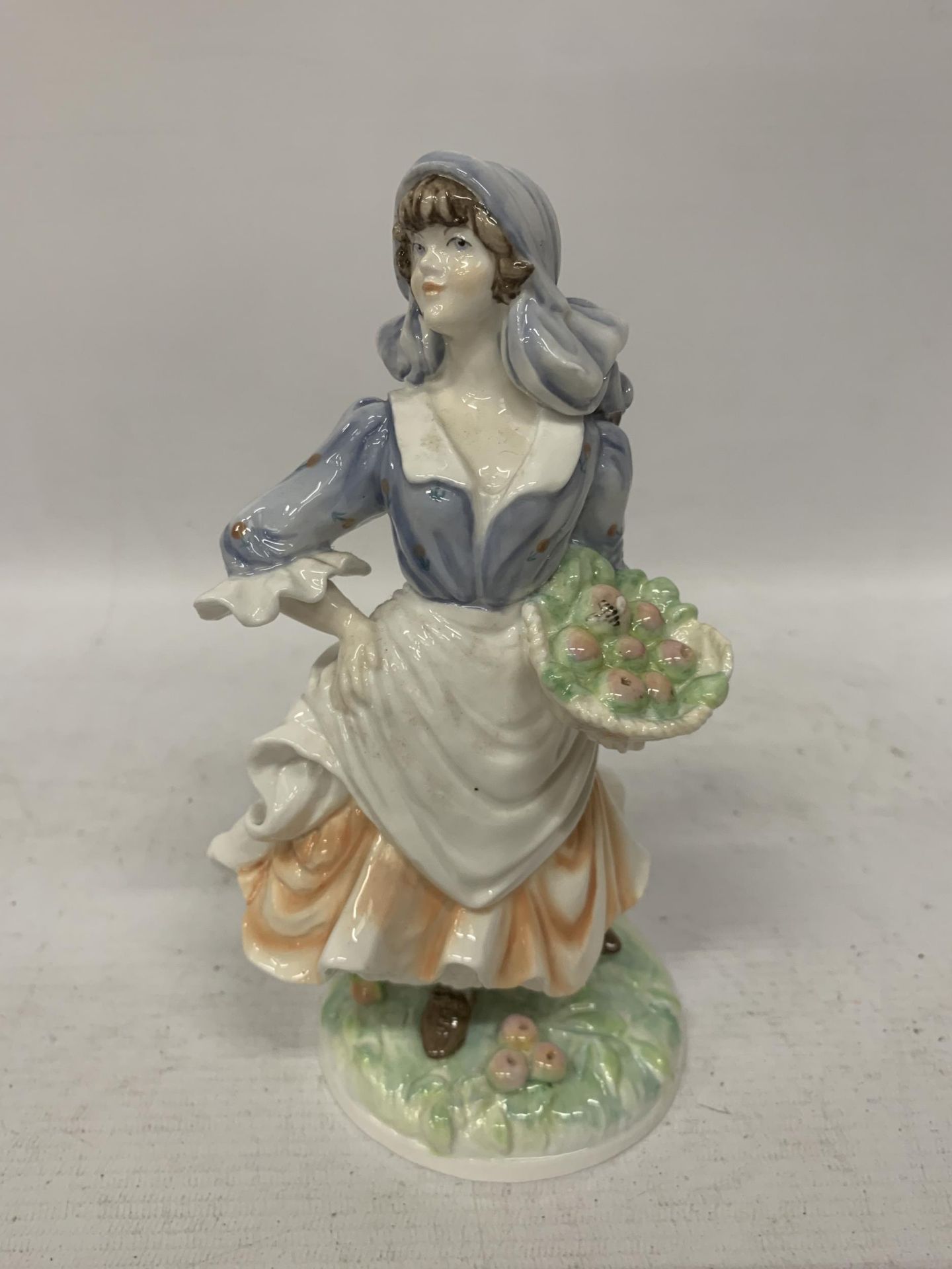 A ROYAL WORCESTER OLD COUNTRY WAYS 'ROSIE PICKING APPLES' FIGURE