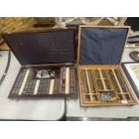 TWO VINTAGE CASED OPTICIANS GLASSES TESTING CASES