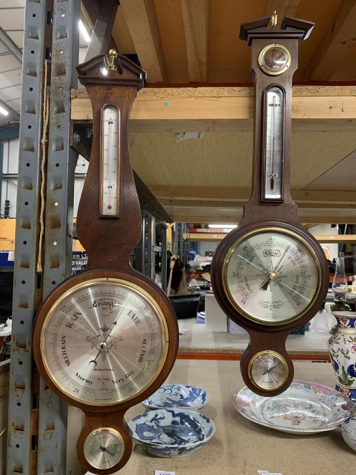 TWO MAHOGANY CASED WALL MOUNTED ANEROID BAROMETERS