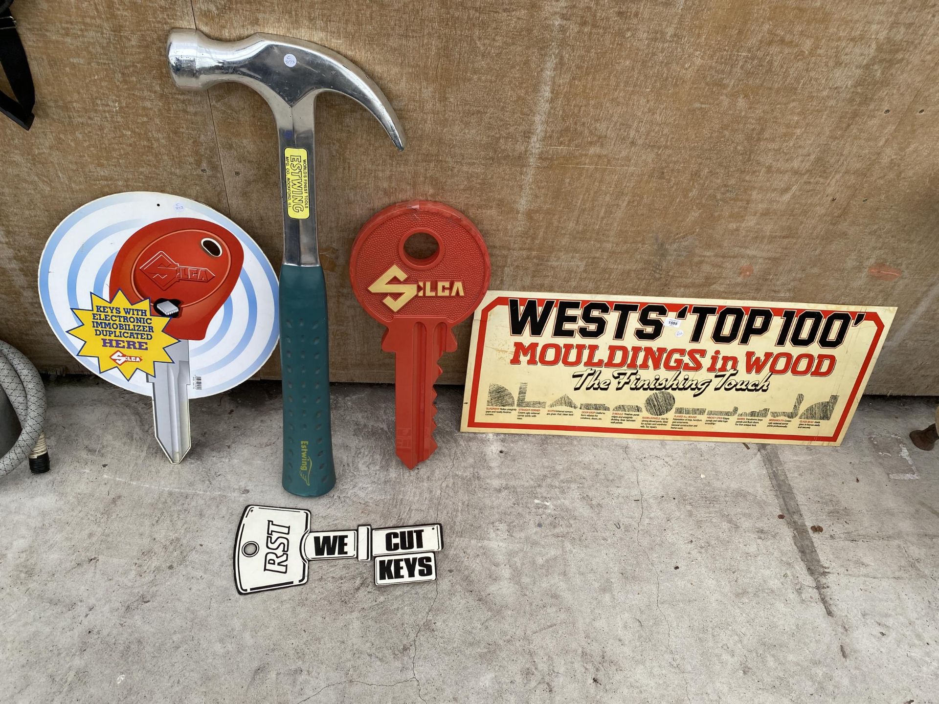 AN ASSORTMENT OF ADVERTISING SIGNS TO INCLUDE KEY CUTTING AND MOULDINGS ETC