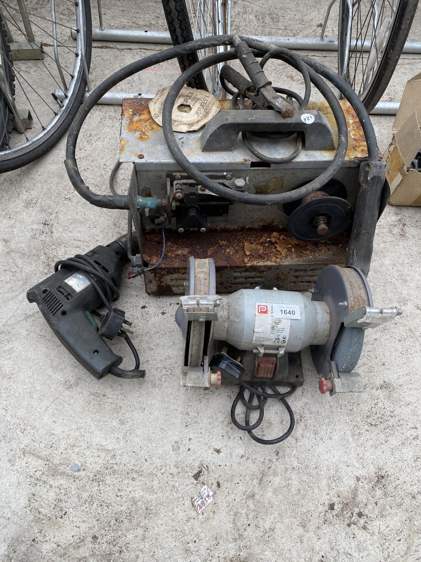 A PROFORMANCE BENCH GRINDER, AN ELECTRIC DRILL AND A MIG WELDER