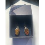 A PAIR OF SILVER AND AMBER DROP EARRINGS IN A PRESENTATION BOX