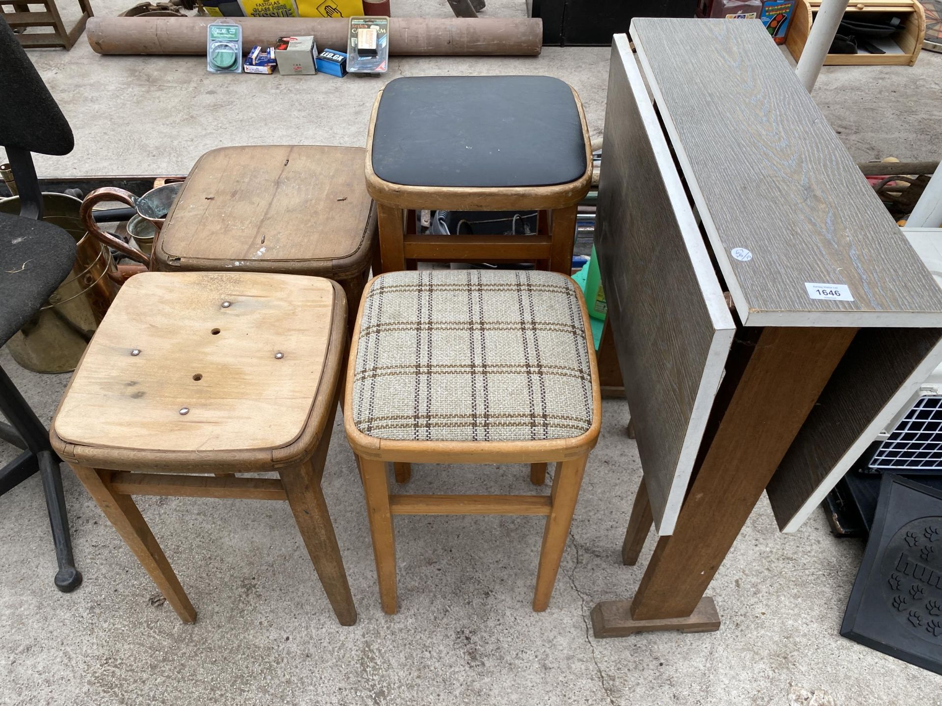 FOUR VARIOUS WOODEN STOOLS AND A FOLDING TABLE