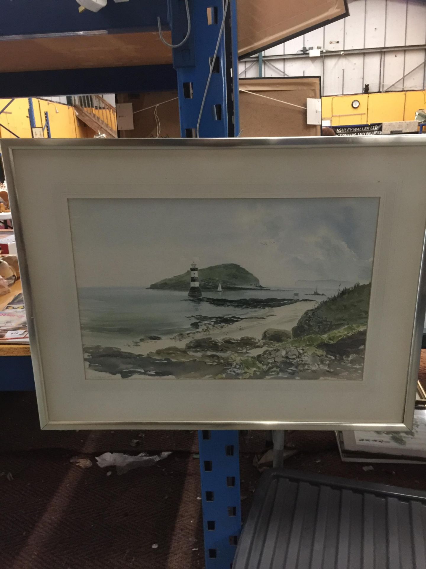 A FRAMED WATERCOLOUR OF A LIGHTHOUSE, SIGNED LOWER LEFT CORNER