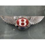 A RED BENTLEY ILLUMINATED BOOT BADGE