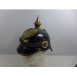 A REPLICA IMPERIAL GERMAN PICKELHAUBE LEATHER COVERED HELMET WITH LEATHER LINING