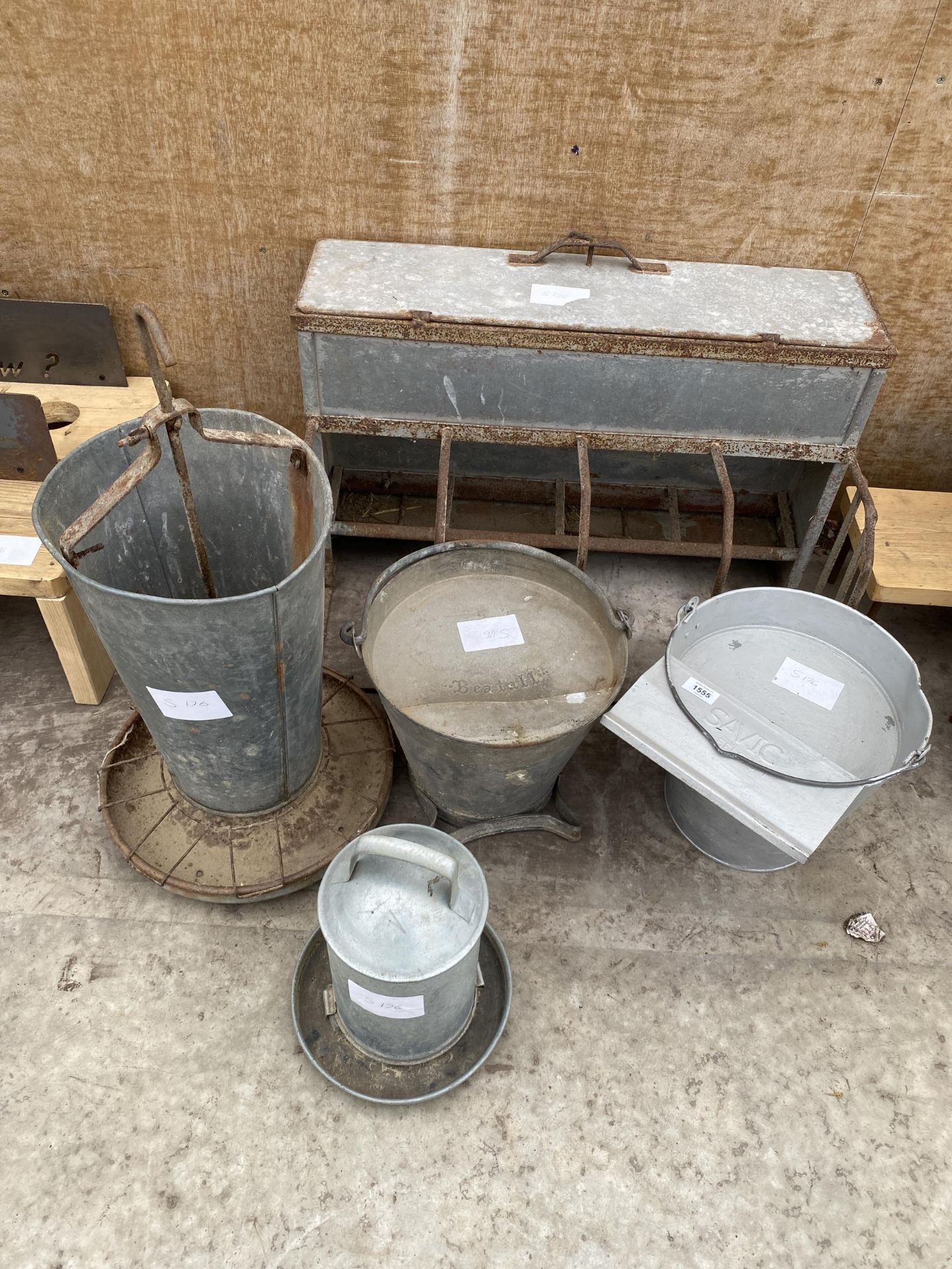 AN ASSORTMENT OF GALVANISED POULTRY FEEDERS AND DRINKERS