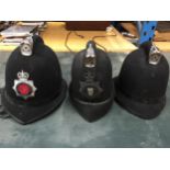 A GROUP OF THREE POLICEMAN HATS, GREATER MANCHESTER ETC