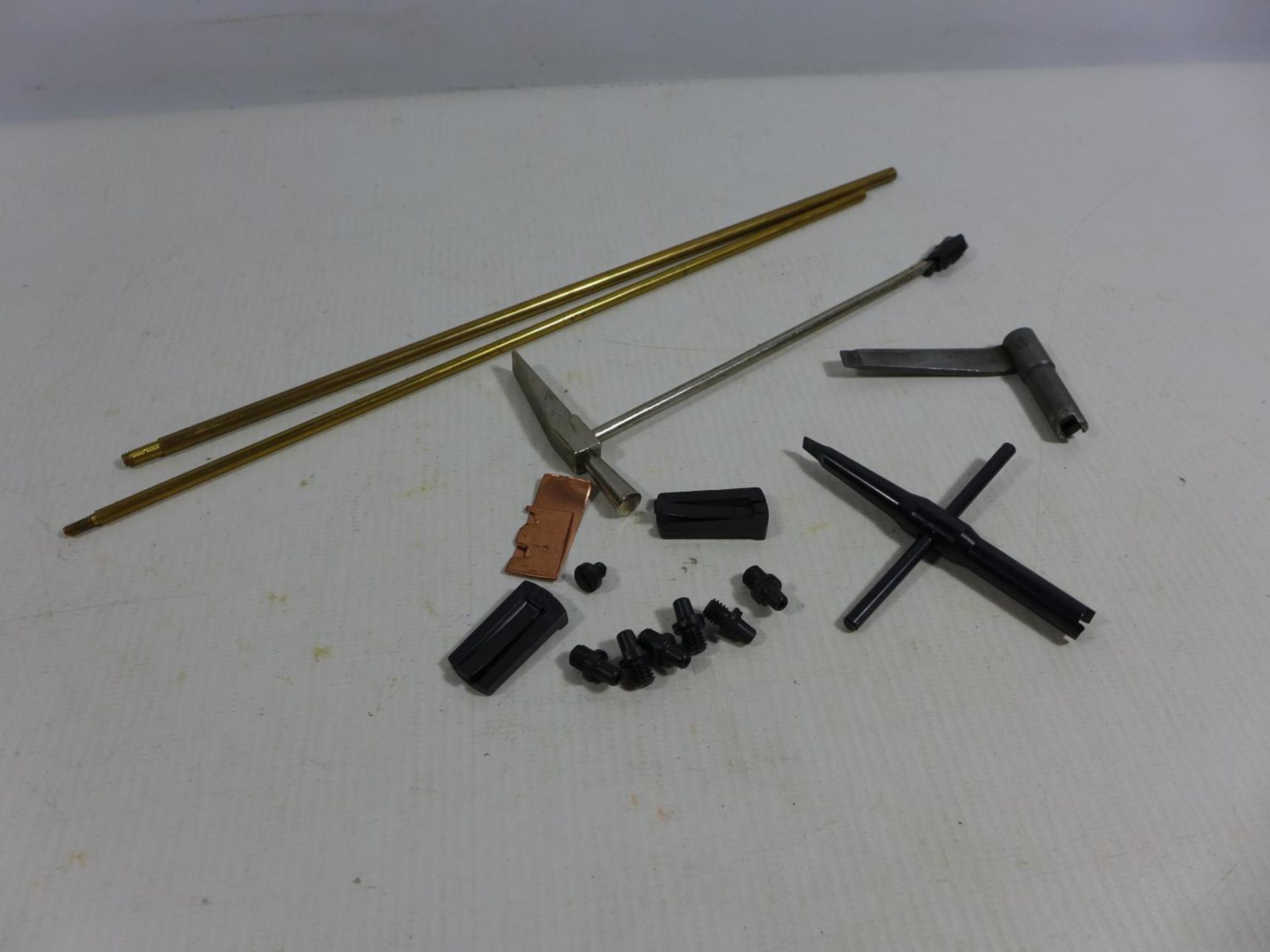 A COLLECTION OF COLT REVOLVER ACCESSORIES, TWO NIPPLE KEYS, SPARE NIPPLES, SLIDES, CLEANING RODS ETC
