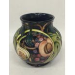 A MOORCROFT 'QUEENS CHOICE' PATTERN VASE BY EMMA BOSSONS, SECONDS