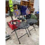 A PAIR OF METAL FOLDING BISTRO CHAIRS WITH TILED BACKS