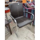 A BROWN LEATHERETTE CHAIR ON TUBULAR CHROME FRAME