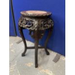 AN ANTIQUE CHINESE CARVED HARDWOOD JARDINIERE STAND WITH MARBLE INSET TOP