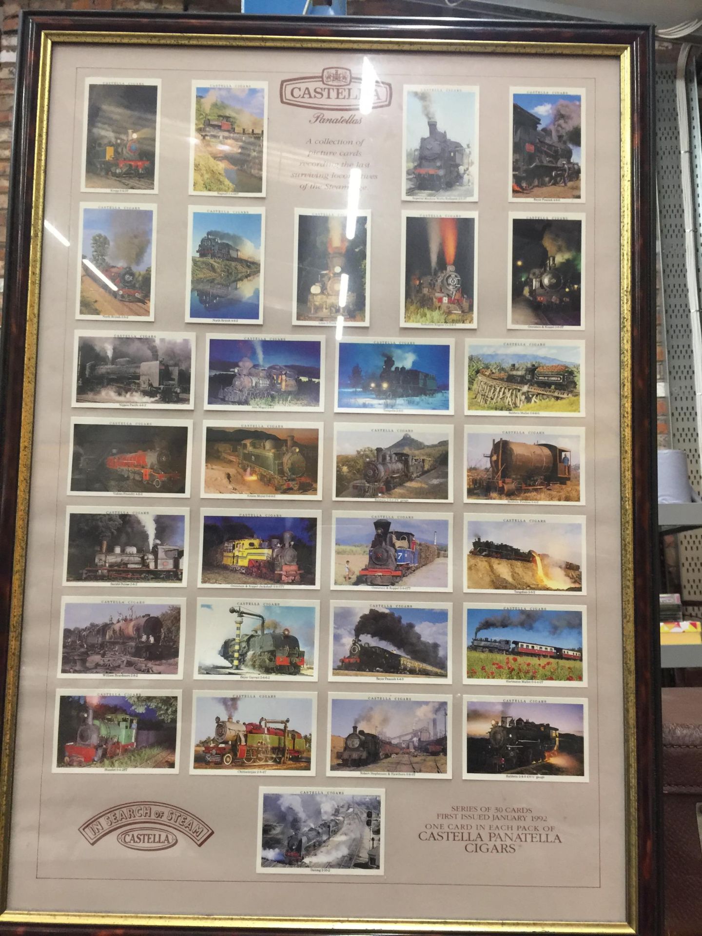 A FRAMED CASTELLA CIGARS STEAM ENGINE PICTURE CARD MONTAGE