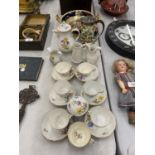 A VINTAGE CHINA TEASET WITH BLUE CROSSED SWORD MARK TO THE BASE (POSSIBLY MEISSEN) TO INCLUDE A