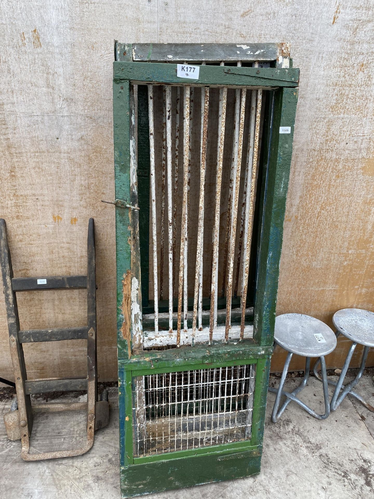 FOUR VINTAGE WOODEN DOORS WITH MESH BOTTOM SECTION AND STEEL BARS TO THE TOP SECTION