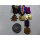 A WORLD WAR I MEDAL GROUP AWARDED TO 3-6477 PRIVATE J McROBBIE OF THE GORDON HIGHLANDERS