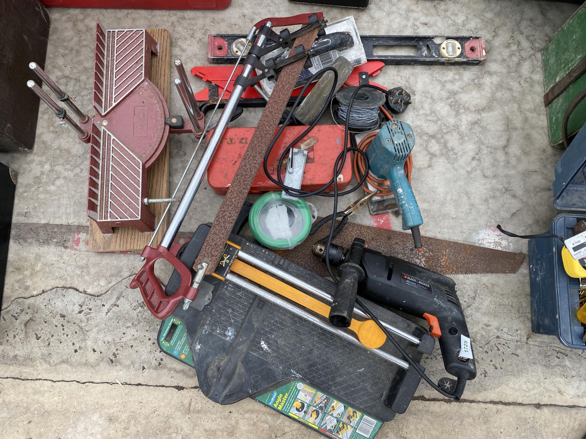 AN ASSORTMENT OF TOOLS TO INCLUDE A DRILL, A MITRE SAW AND A SPIRIT LEVEL ETC