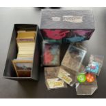 A TRAINER BOX OF ASSORTED POKEMON CARDS, GAME TOKENS, HOLOS ETC