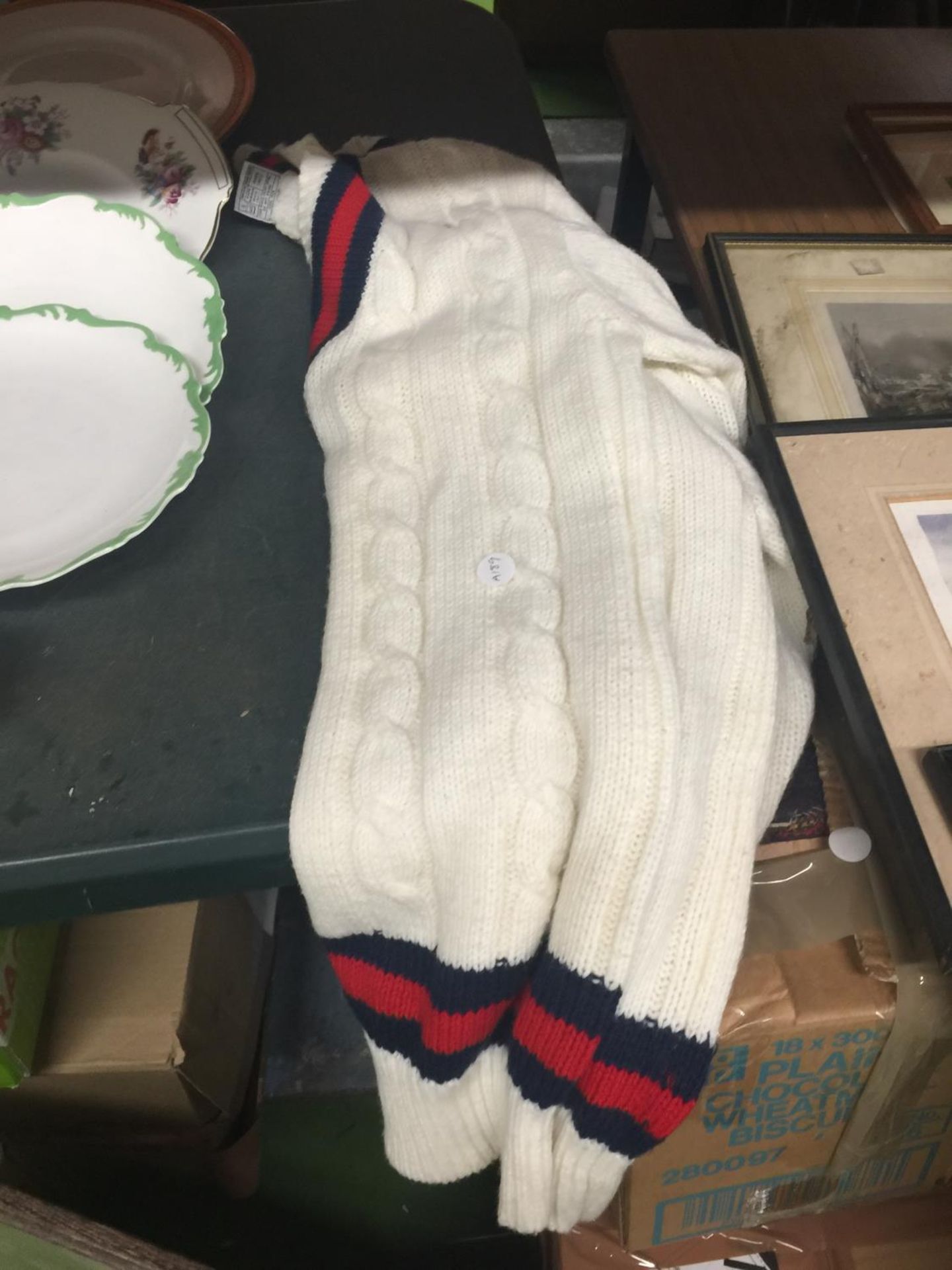 A 'SPORTSWEAR BY CLIVE LLOYD' MEDIUM SIZED CRICKET JUMPER RETAILS FOR £120-£180