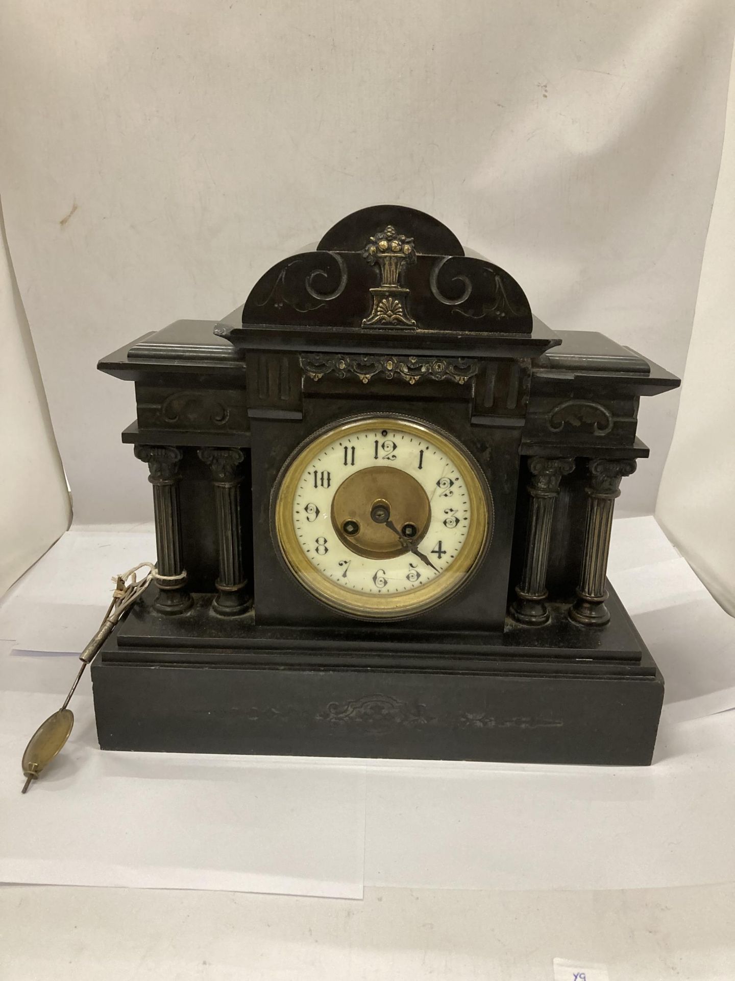 A VICTORIAN SLATE CHIMING MANTLE CLOCK WITH PENDULUM AND KEY