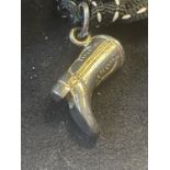 A COWBOY BOOT CHARM IN A PRESENTATION BOX