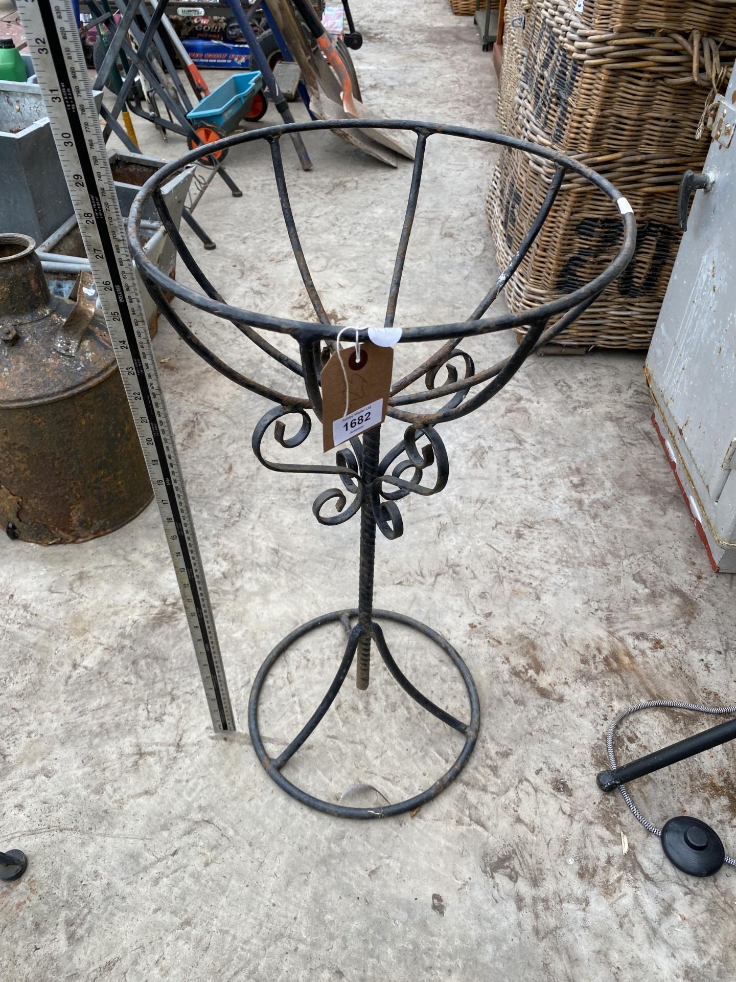 A WROUGHT IRON PLANT STAND