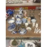 A QUANTITY OF BLUE AND WHITE CERAMICS, FIGURES, CANDLESTICKS, ETC