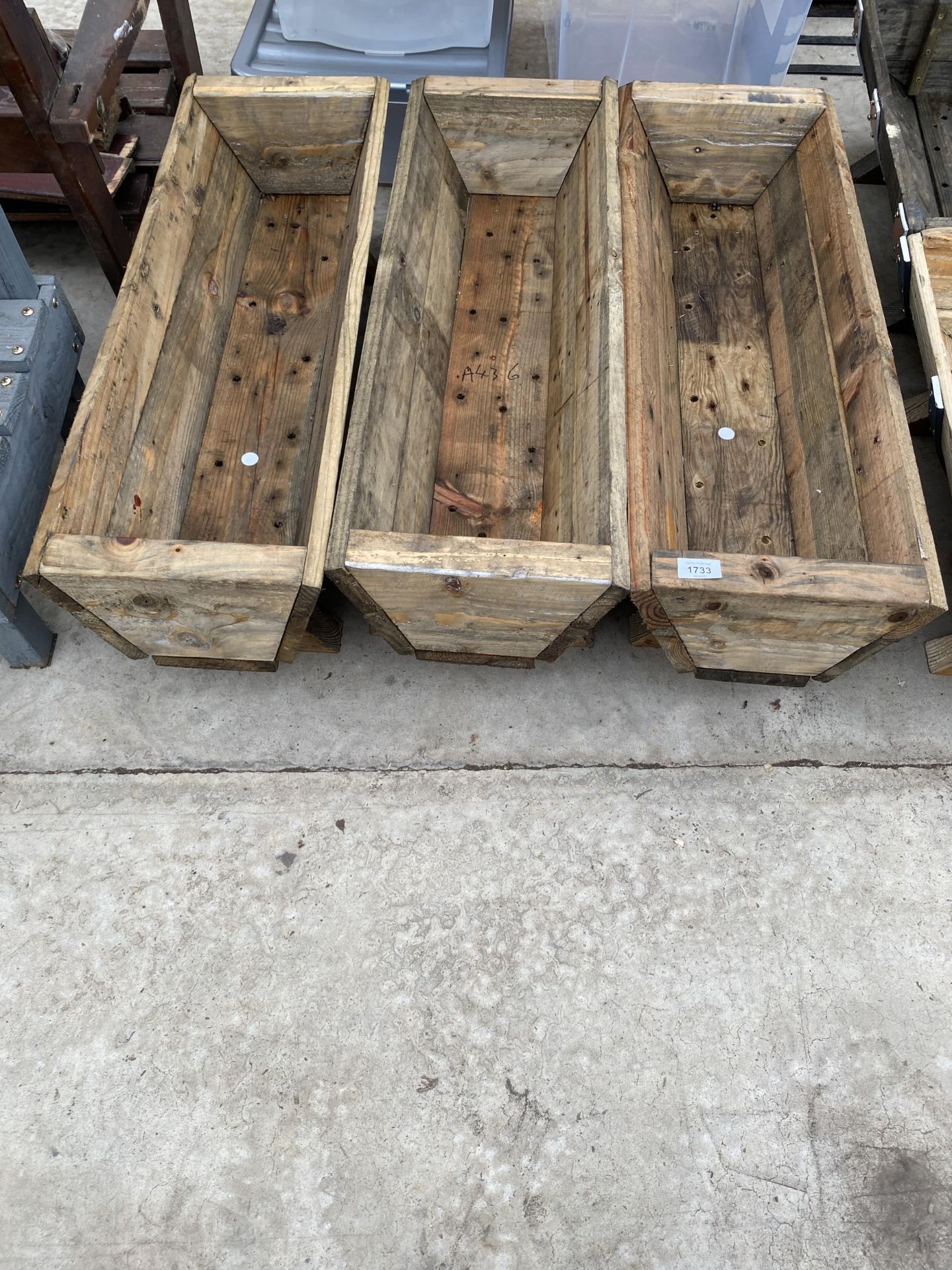 THREE RUSTIC WOODEN TROUGH PLANTERS