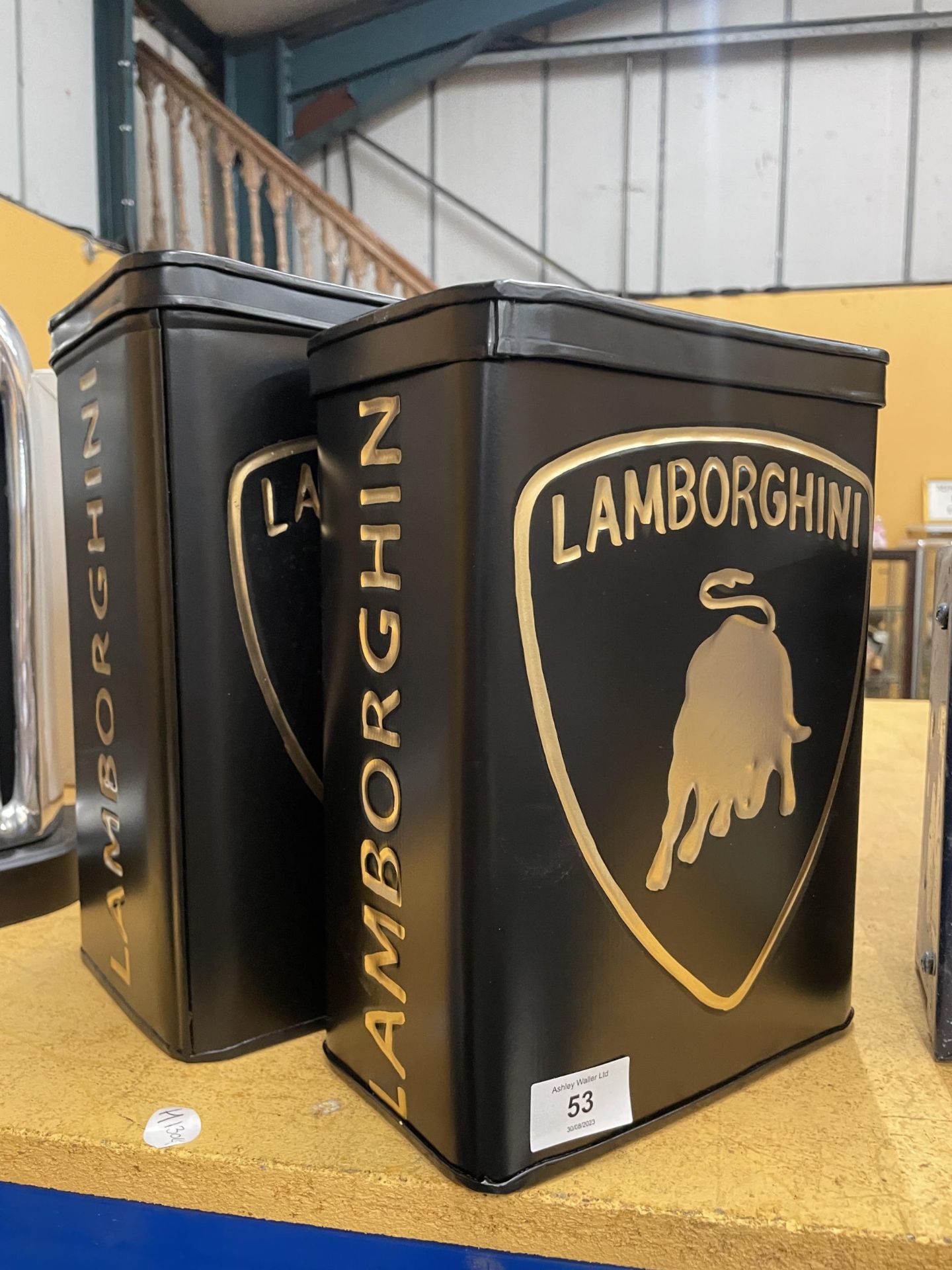 TWO BLACK METAL LAMBORGHINI PETROL STORAGE CANS