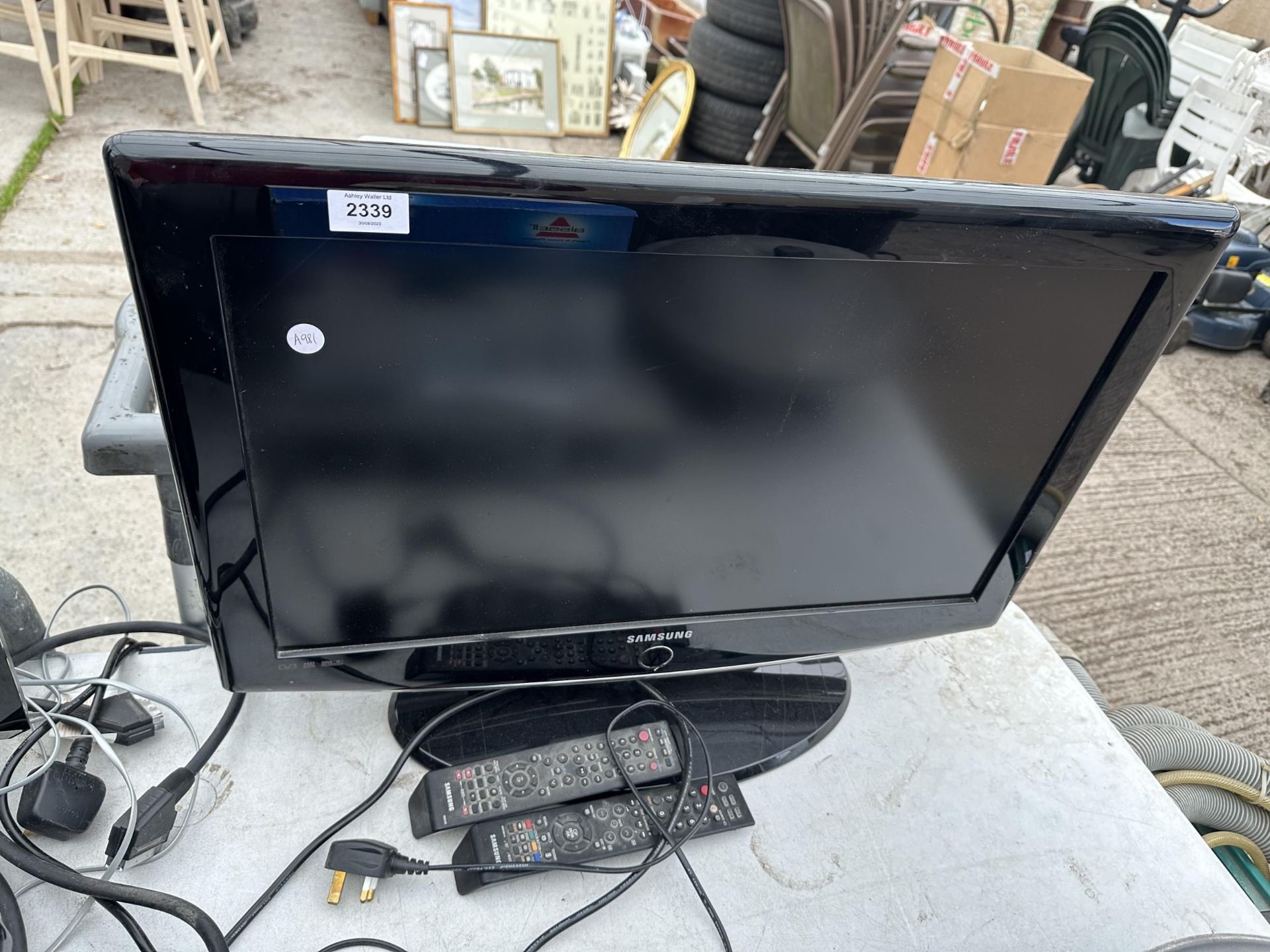 A SAMSUNG 26" TELEVISION WITH REMOTE CONTROL