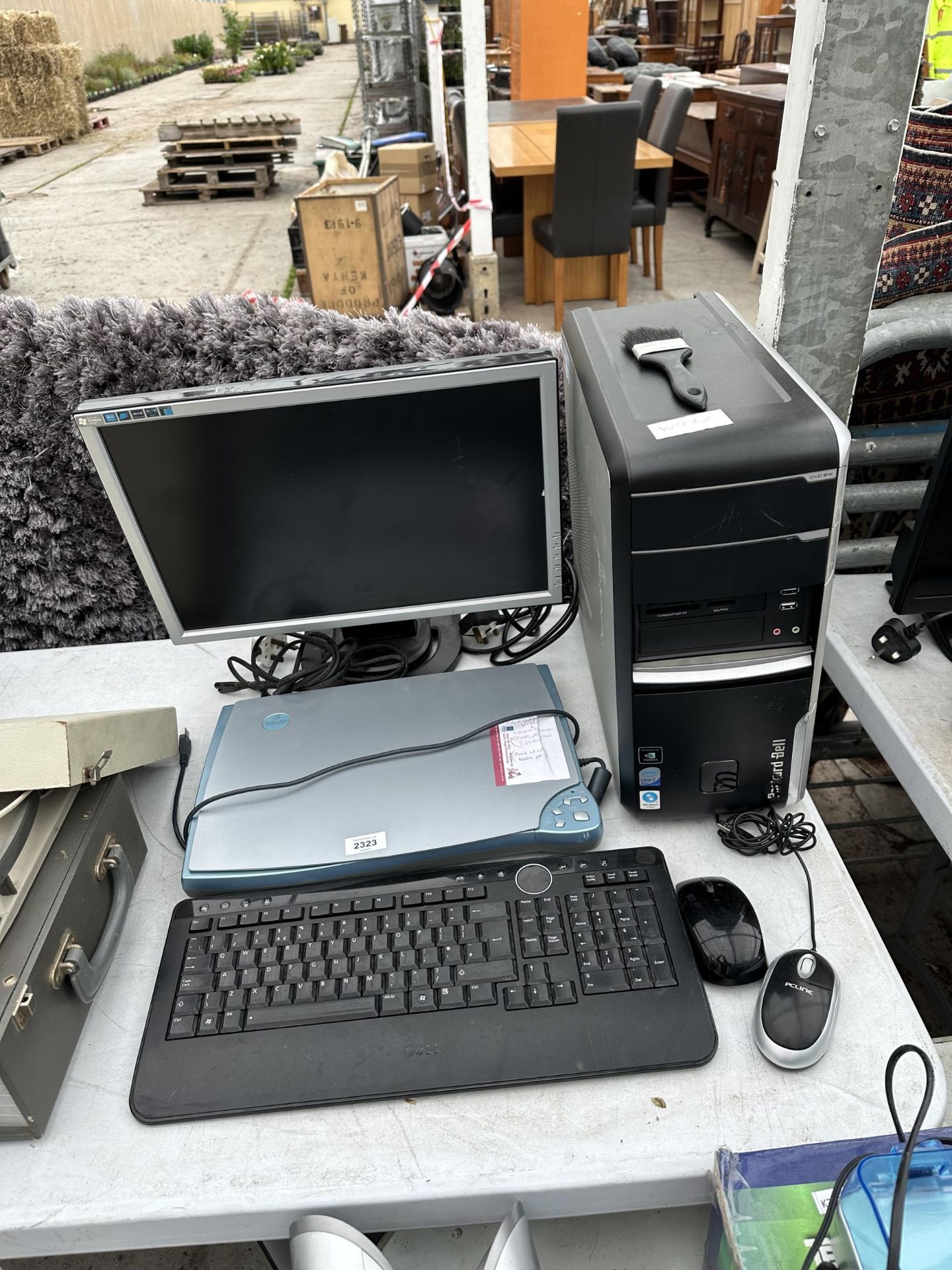 AN ASSORTMENT OF COMPUTER ITEMS TO INCLUE A PACKARD BELL TOWER, A MONITOR AND A KEYBOARD ETC