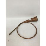 A VINTAGE COILED COPPER HUNTING HORN