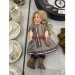 A VINTAGE CONTINENTAL DOLL WITH PORCELAIN HEAD AND BODY, ARTICULATED LIMBS, SLEEPY EYES IN